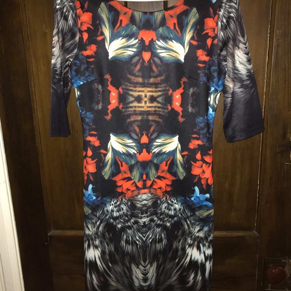 Sweet Miss Black Floral fitted dress with three quarter length sleeves.